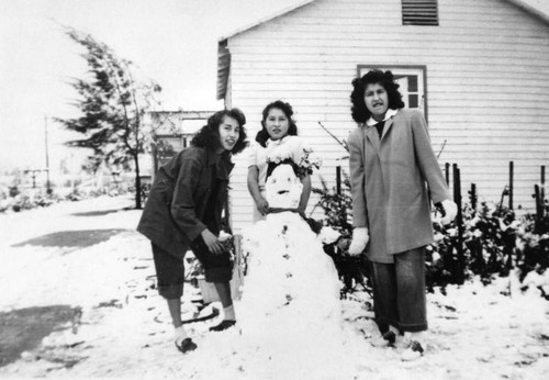 Mexican American woman with snowman