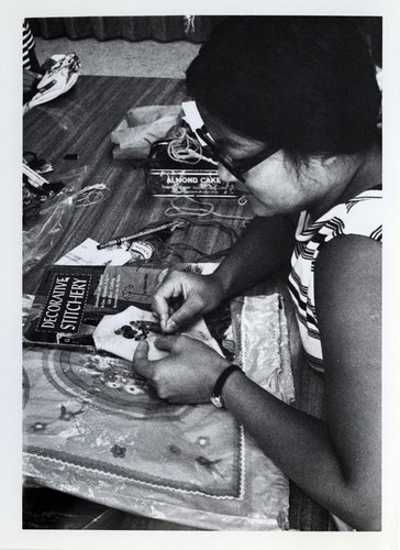 Woman embroidering by hand
