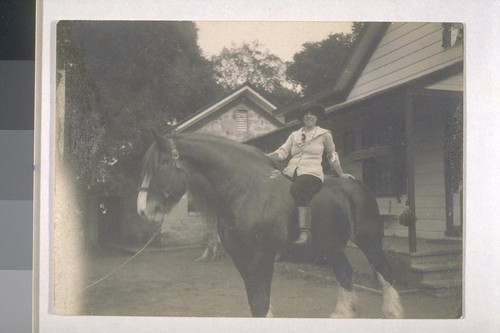 [Charmian Kittredge London on horse.]