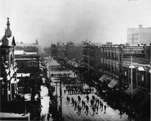 Looking south on Main Street from Second Street in Downtown Los Angeles as sailors march through town, ca.1891