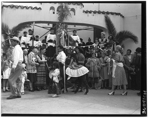 Children participating in a religious ceremony on Olvera Street, Los Angeles