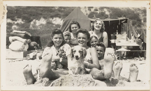 Women and dog on beach