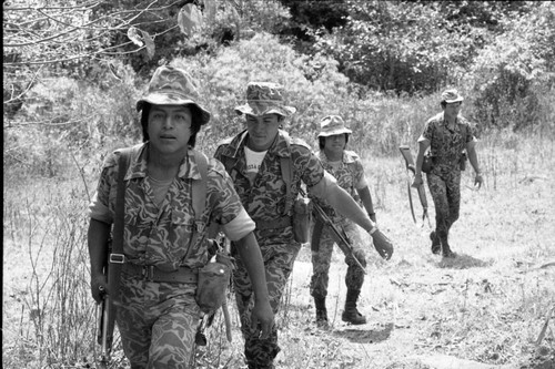 Four soldiers patrolling mountainous terrain, Guatemala, 1982