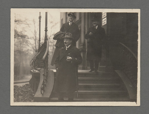 [Otto Stern on right and James Franck on left, Peter Debye at bottom of steps.]