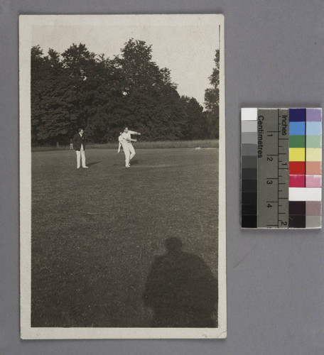 Edwin Powell Hubble pitching a baseball in a game in Oxford, England