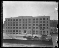 Exterior of city jail at Lincoln Heights with street in front, circa 1920