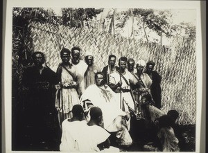 Cameroon, Grassfields, Fumban. Bagam King with his servants in his compound