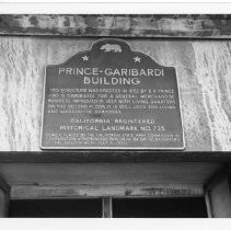 View of the plaque for the Prince-Garibardi Building a general merchandise business in Altaville, California. California State Landmark #735, Calaveras County