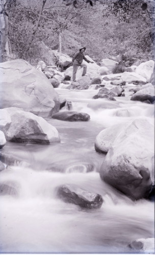 Man Posing in a Rocky Stream