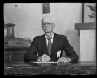 Samuel T. S. Doncyson, businessman, seated at a desk, Montebello, 1935
