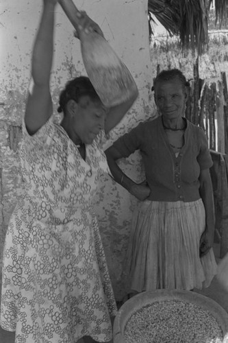 Woman grinding corn, San Basilio de Palenque, ca. 1978