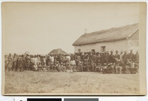 Parishioners of Mahanaim and missionaries in front of a house with a cross on top, South Africa