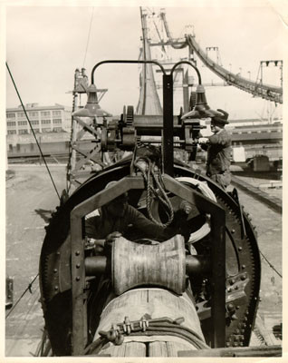 [Workers pressing cable for the San Francisco-Oakland Bay Bridge]