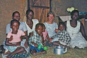 Missionary and Teacher Anna Marie Wemmelund-Nielsen visiting a local family in the North Wester