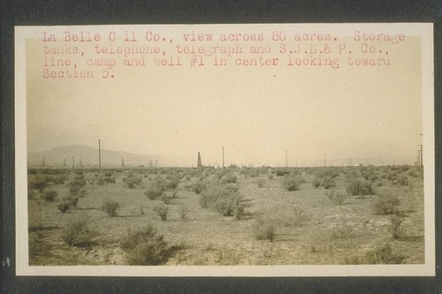 La Bell Oil Company, view across eighty acres. Storage tanks, telephone, telegraph, telegraph and S.J.L.&P. Company, line, camp and well number one in center looking toward Section five