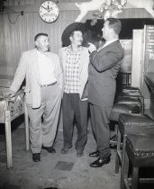 Three men standing and talking at RIngside Bar