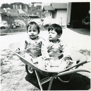 Martinez brothers in a wheel barrow, East Los Angeles, California