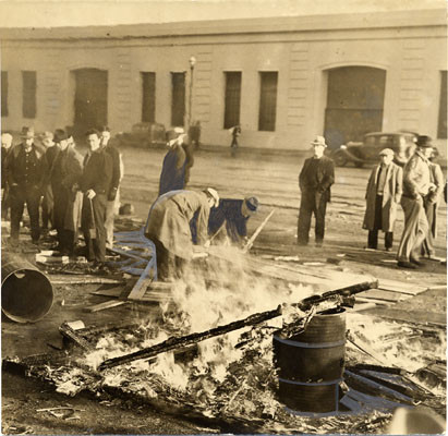 [Dock workers burning a shack at end of strike]