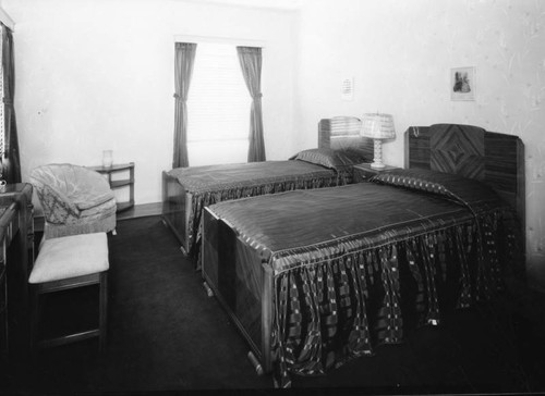 Two beds in a bedroom, interior view
