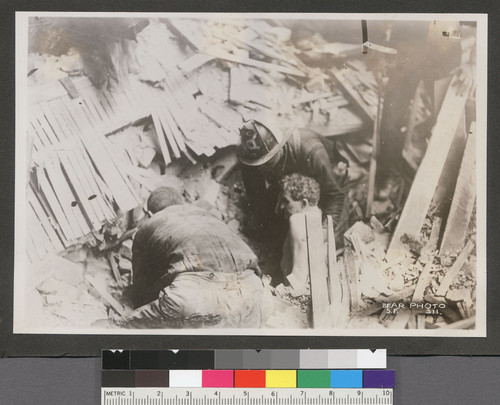 [Rescuers pulling survivor from rubble of Wilcox Building. Second and Jessie Sts.]