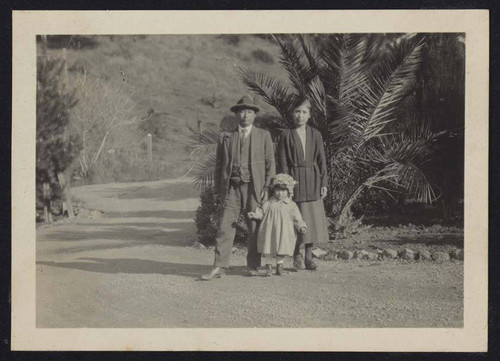 Man, woman, and child outside