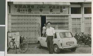 John Chang Stands in front of his Publishing House, Kuala Lumpur, Malaysia, 1967