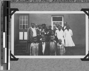 Petrus Mazwi with family in front of his house, South Africa East, 1933