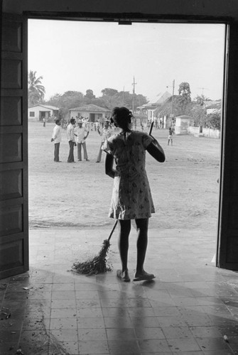 Woman sweeping the floor, San Basilio de Palenque, 1976