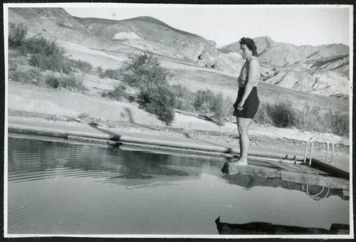Photograph of L. Josephine Hawes standing on a diving board on New Year's Day in Death Valley