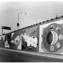 View of the seven murals painted on a freeway retaining wall in Duarte, California. Sponsored by the California Division of Highways, high school and college students chose their own designs for the murals