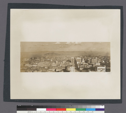 1910. [Cityscape from Nob Hill (Fairmont Hotel?) looking east along California St. toward Ferry Building.]