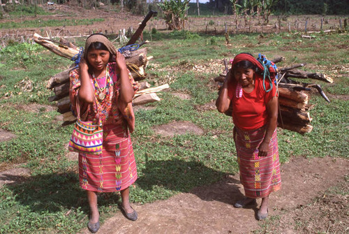 Mayan women carry load, Ixcán, ca. 1983