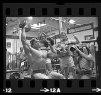 Documentary crew filming Arnold Schwarzenegger working out at Gold's Gym in Venice, Calif., 1975