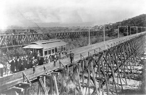 Bridge across the Arroyo Seco at Garvanza, showing the first cable-car to cross it, ca.1895