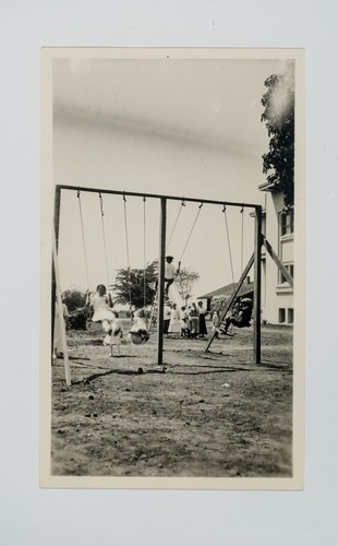 Picnic Day: Children Playing on Swings