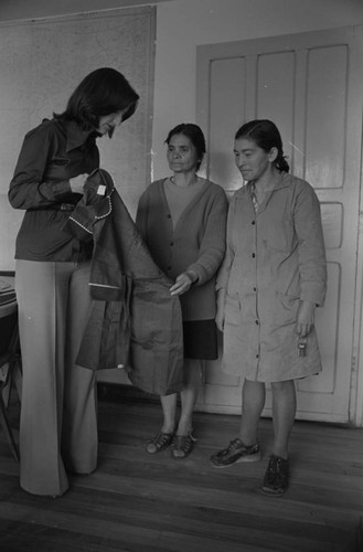 Three women and a dress, Tunjuelito, Colombia, 1977