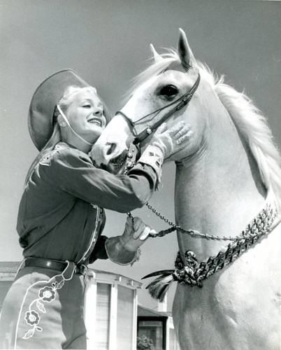 Publicity photo of June Havoc with horse for Malibu Remuda, 1947