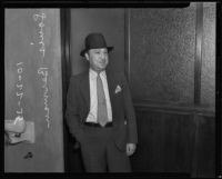 Realty racketeering criminal Louis Berman stands outside courtrooom, Los Angeles, 1935