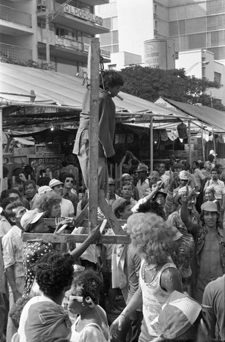 Young boy performing from a gallows, Barranquilla, Colombia, 1977