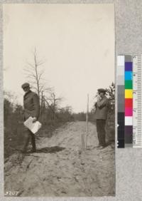 State Forester Schaaf and Custodian Van Sickle at section corner intersection of two fire lines discussing planting plans. White pine is used only on better quality land under some cover of other species, or where frost is not bad. May 2, 1924