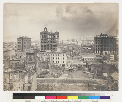 [View of ruins of financial district. Looking east along Pine St. showing Kohl (left), Merchants' Exchange (left center) and Mills (right) Buildings.]