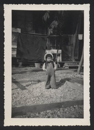 Yoshie in front of clothes line at Poston incarceration camp