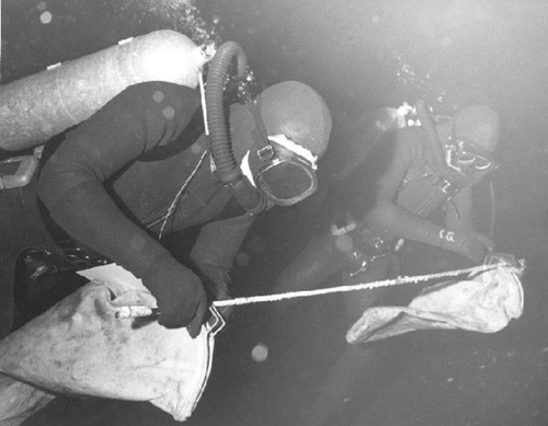 Paul Dayton (foreground) and Chuck Galt, during Paul Dayton's benthic ecology research project. near McMurdo Station, Antarctica. 1968