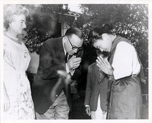 [Governor and Mrs. Edmund G. Brown greeting a Laotian minstrel girl (photo used in fake pamphlets)]