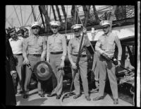 Four sailors with equipment on the USF Constitution, San Pedro, 1933