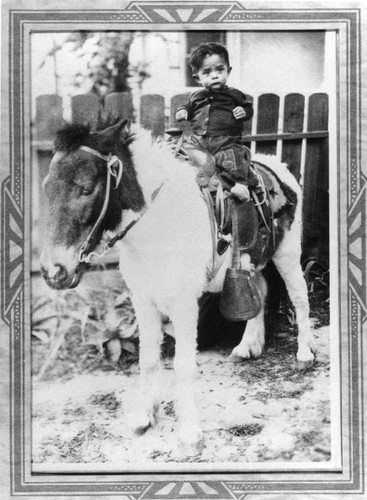 Mexican American child on pony