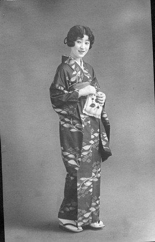 [Woman in kimono and geta]