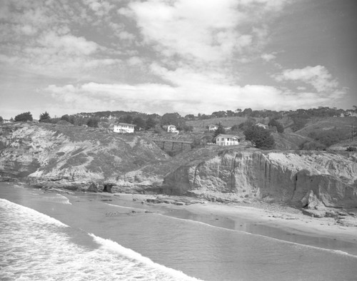A view looking towards Scripps Institution of Oceanography, note the residential cottages and trestle Walk Bridge which no longer exists. Circa 1950