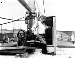 Unidentified man aboard a ship on the Petaluma River, Petaluma, California, about 1959