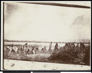 Mojave Indians mourning at the perimeter of cremated ashes